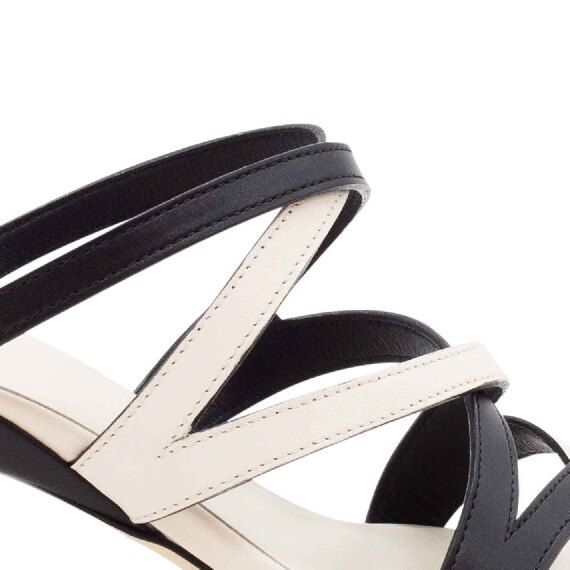 Slash criss-cross slip-on sandals in black/white leather