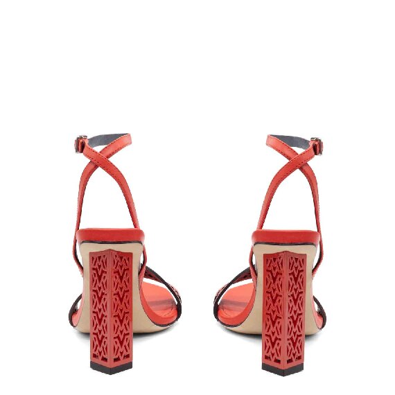 Openwork monogram sandals in coral calfskin