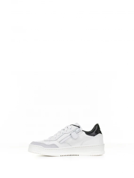 White leather sneaker with black heel