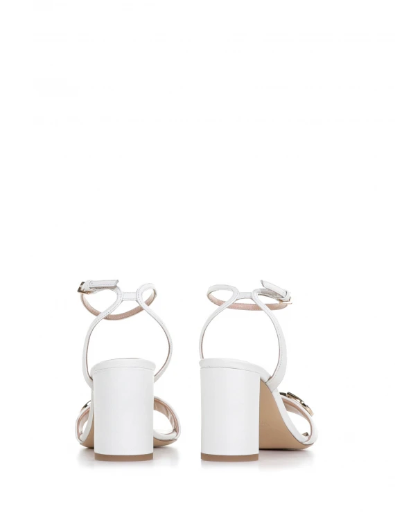 Sandal with heel and strap