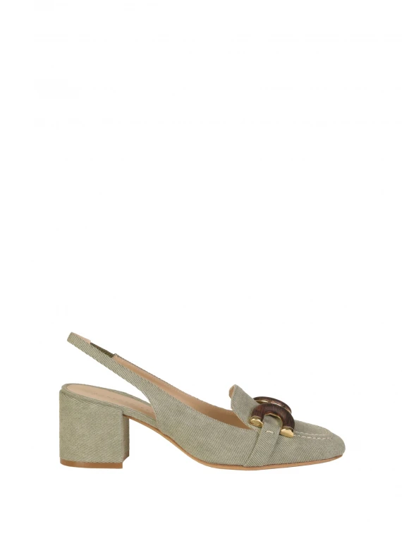 Chanel slingback in khaki jeans with wooden accessory