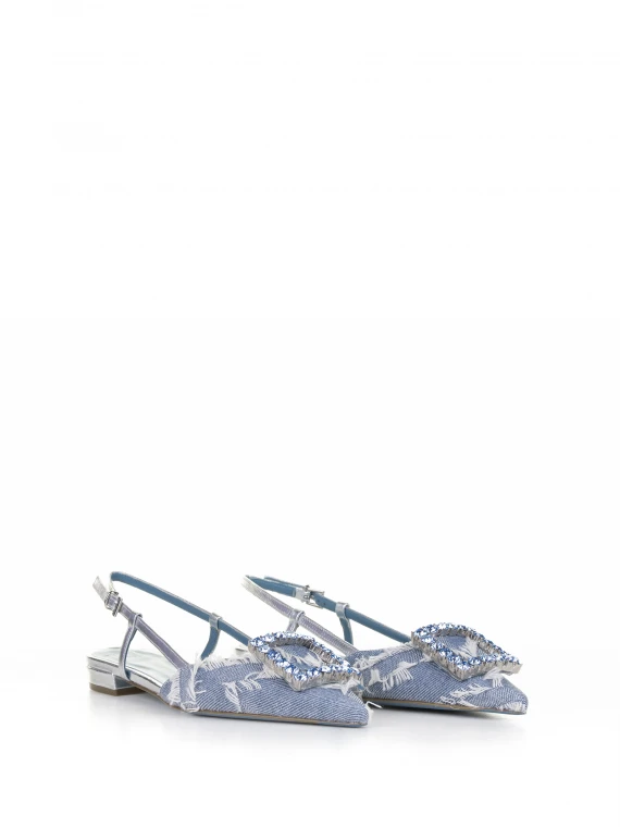 Chanel slingback in denim jeans with rhinestone accessory