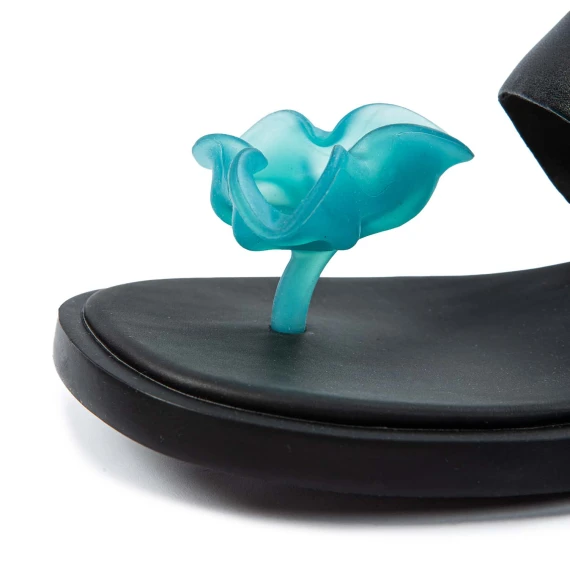 black flip flops with light blue flower