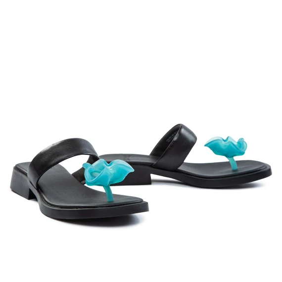 black flip flops with light blue flower