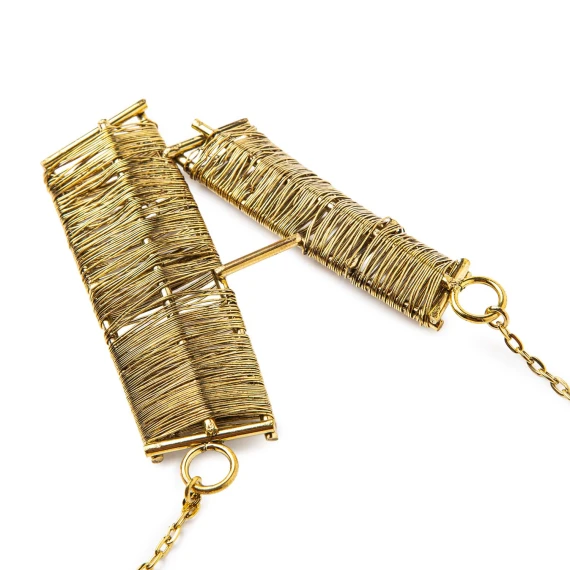 gold necklace with metallic accents