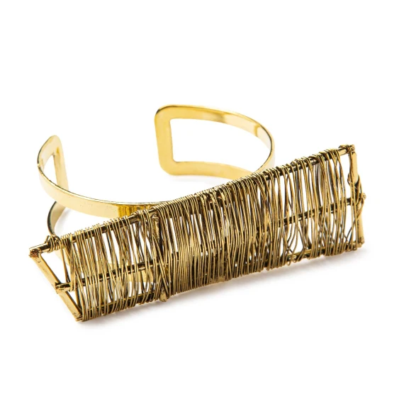 bracciale rigido oro con dettagli metallici