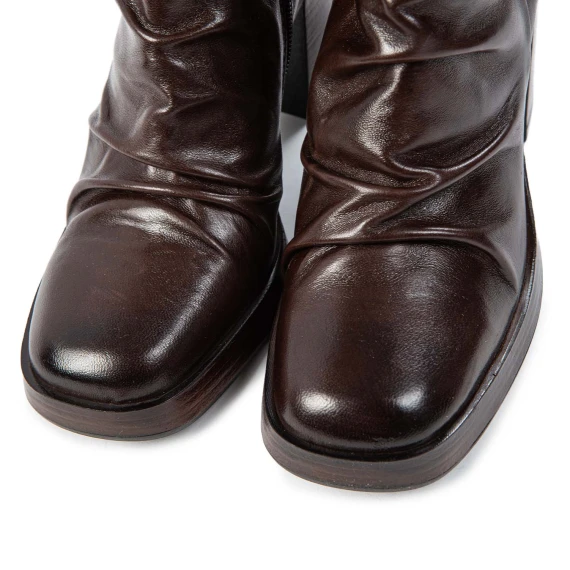 Mocha-colored leather ankle boots with a heel and platform