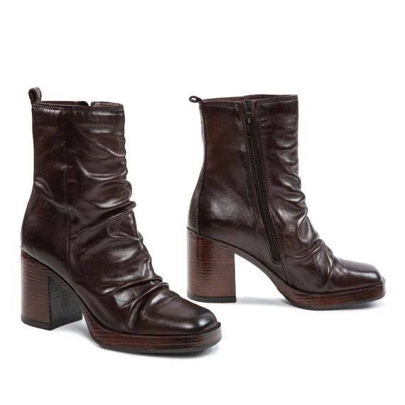 Mocha-colored leather ankle boots with a heel and platform