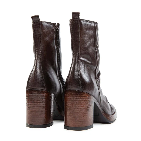 Mocha-colored leather ankle boots with a heel and platform
